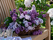 Lilac bouquet in wicker basket