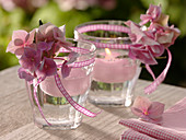 Small glasses with hydrangea, ribbon
