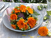 Small wreath out of marigolds and herbs