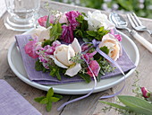 Small roses and herbs wreath as napkin deco