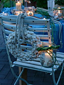 Maritime table decoration on terrace in evening mood