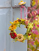 Small hanging wreath of zinnias and fennel