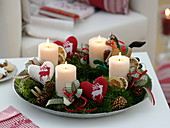 Advent wreath of Abies, decorated with heart with heart decoration