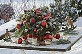 Frozen Christmas bouquet of pinus branches and cones, Ilex