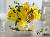 Small bouquet of Narcissus, Ranunculus, Cytisus