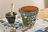 Glue clay pots with turquoise mosaic