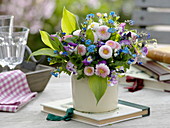 Spring bouquet with bellis, myosotis, viola