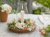 Lanterns with wreath made of roses, hydrangea