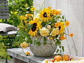 Yellow summer bouquet in ball vase