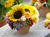 Late summer arrangement with Helianthus (sunflower), pink