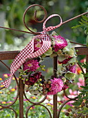 Autumn wreath on the fence from Callistephus, Hydrangea