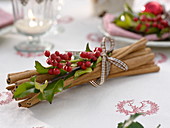 Cinnamon sticks tied together with checkered ribbon