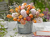 Fragrant spring bouquet in little metal bucket