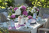 Pink and white peony table decoration on the terrace