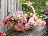 Spank basket with fresh cut pink (rose) from the garden
