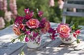 Small bouquet of roses in rose cup