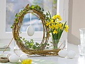 Easter window decoration with willow egg and daffodils