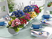 Primrose table decoration with planted zinc gutters