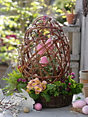 Wicker basket with egg made from Salix (kitten pasture) branches as decoration