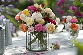 Colorful mixed bouquet of pink (rose) in glass vase