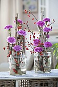 Birch stems tied together as support for flower arrangement