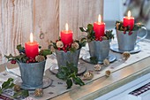 Unusual Advent wreath from individual zinc cups, red candles, Ilex