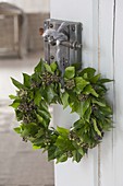 Hedera wreath(ivy) hung on door handle