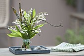 Scented bouquet of Convallaria majalis (Lily of the Valley) with twigs