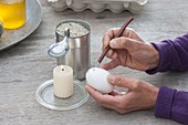 Egg coloring with wax reservation technique