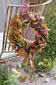 Wreath of Amelanchier leaves on the back of the chair