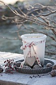 Frozen lantern with ribbon and heart