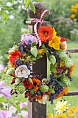 Small edible flowers wreath, tea herbs and wild fruits