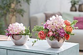 Small spring arrangements in cups, rhododendron, malus