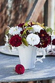 Red and white mini-bouquet from Bellis, Primula
