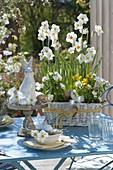 White Easter table decoration on the terrace
