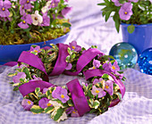 Wreath made of horned violet, sage and purple ribbon