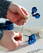 Tying a Christmas Bouquet - Tying small glass balls to a wire
