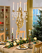Festive table decoration with garland and balls