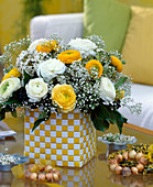 Bouquet maade of yellow and white ranunculus, white gypsophila