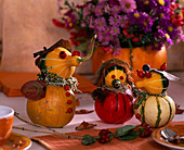 Figurines of ornamental gourds, rose hips, calluna, leaves