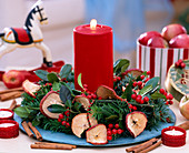 Apple slices, twigs and candle wreath