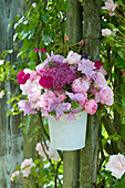 Romantic bouquet made of roses, malva (mallow)