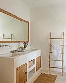 Masonry washstand with wooden doors in natural bathroom