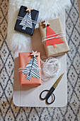 Wrapped gifts with paper Christmas tree gift tags