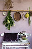 Mediterranean decorations hung from bamboo pole above old bench