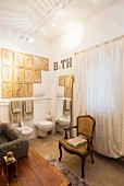 Baroque chair, gallery of pictures and full-length mirror in bathroom in natural shades