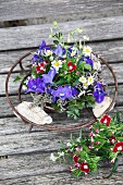 Arrangement of delphiniums and sweet Williams in metal dish
