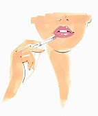 Close up beautiful woman applying pink lipstick
