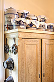 Stoneware pots on top of old wooden cupboard