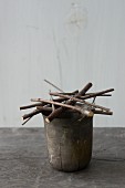 Flower stand made from twigs and wire on vintage pot
